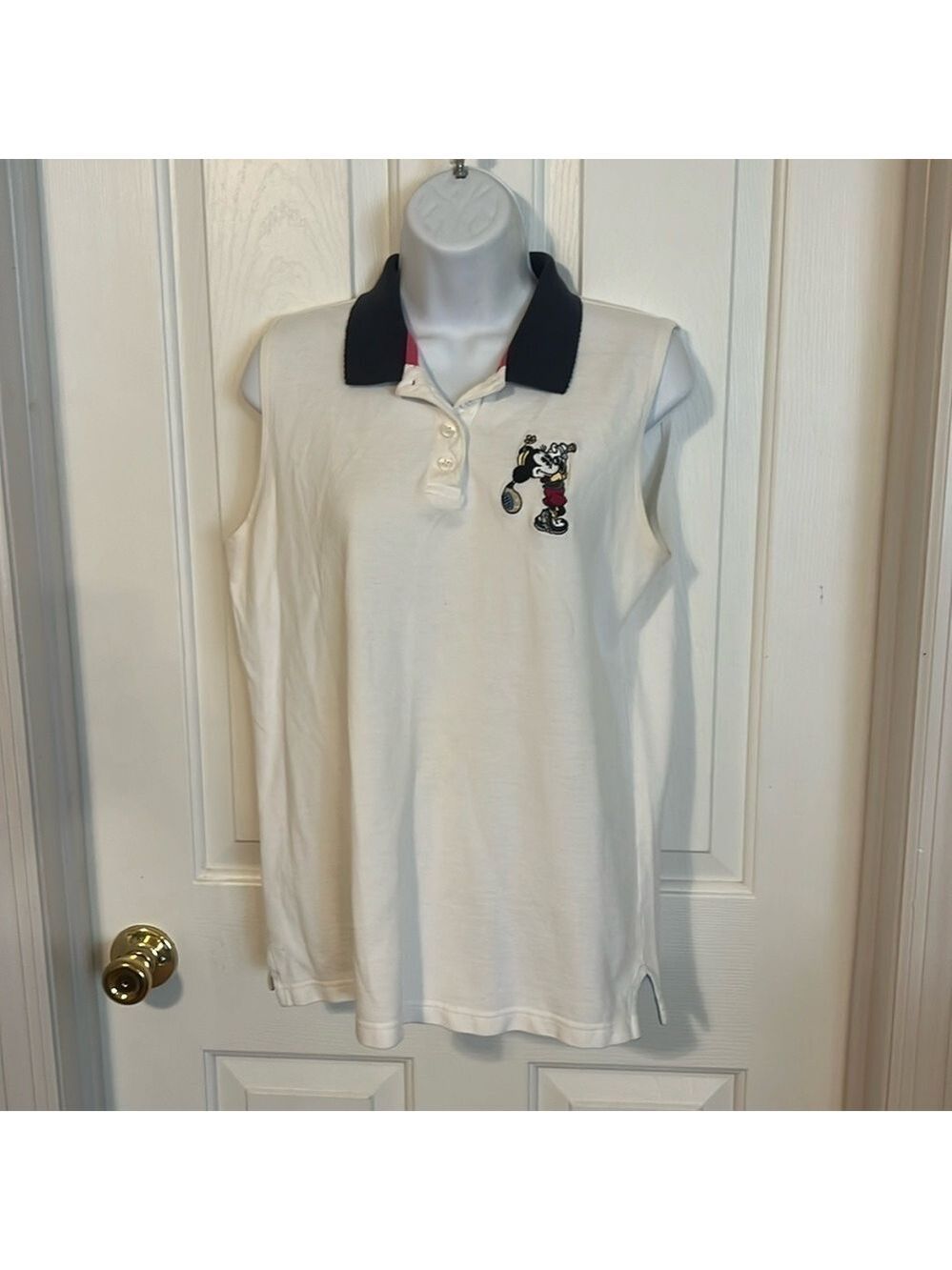 Disney Store golf sleeveless polo shirt. Size (?) small. Tag is faded. Preowned